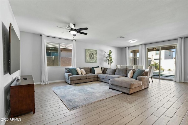 living room featuring ceiling fan