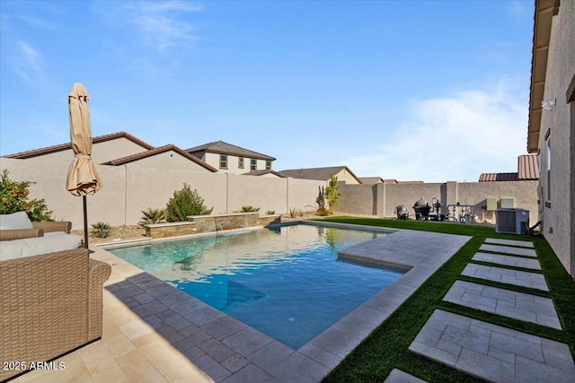 view of swimming pool with pool water feature, central AC unit, and a patio