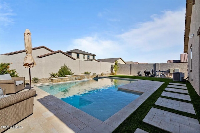 view of swimming pool featuring cooling unit, a patio area, and pool water feature