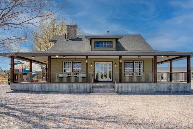 rear view of property with covered porch