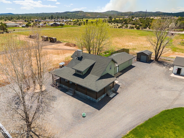 birds eye view of property featuring a mountain view