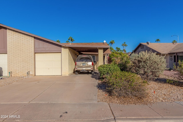 view of property exterior with a garage and a carport