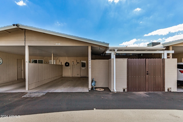 exterior space featuring a carport