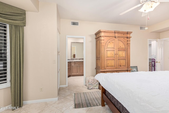 bedroom featuring ensuite bath and light tile patterned floors