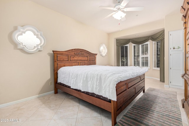 bedroom with ceiling fan and light tile patterned flooring