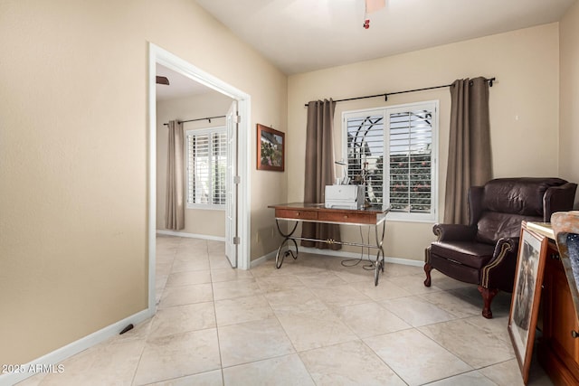 sitting room with light tile patterned floors