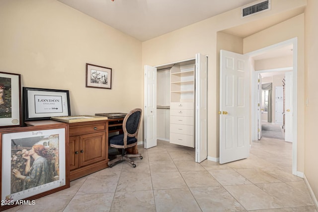 office with light tile patterned flooring