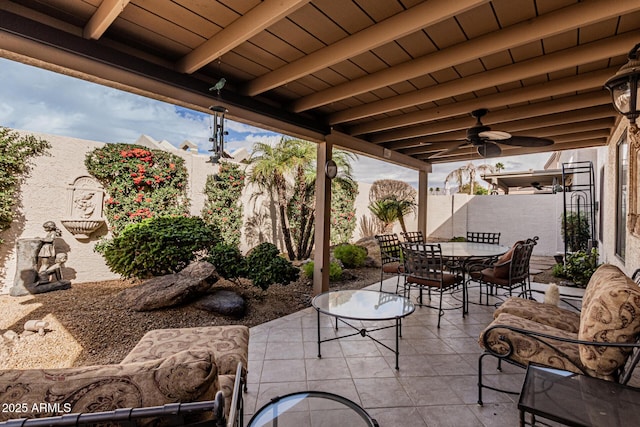 view of patio featuring ceiling fan