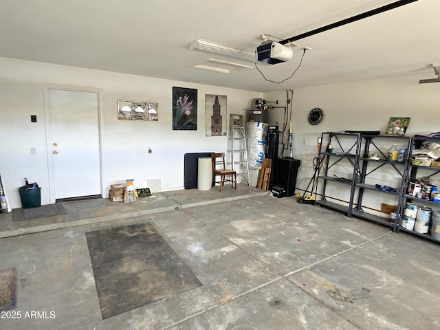 garage with a garage door opener and water heater