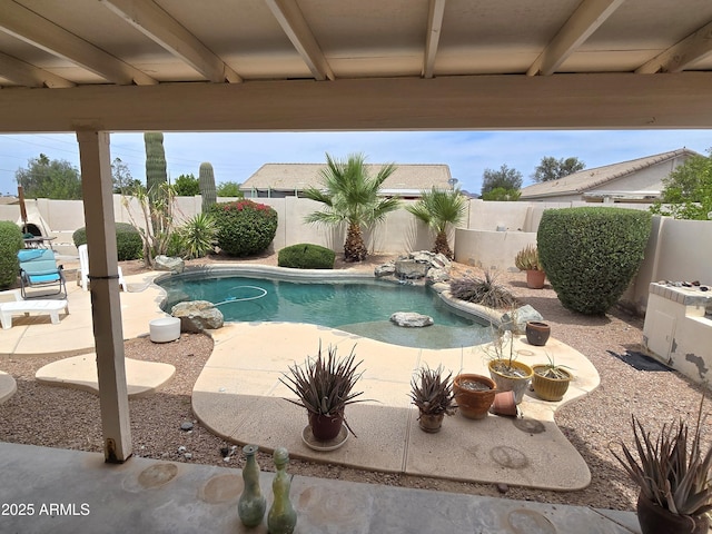 view of pool with a fenced backyard and a patio area