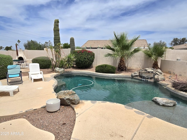 view of pool featuring a fenced backyard and a patio area