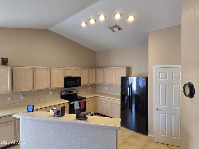 kitchen featuring black appliances, light brown cabinets, vaulted ceiling, light countertops, and light tile patterned floors
