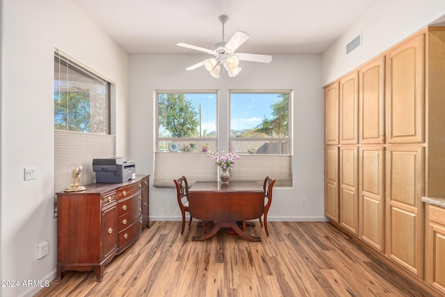 dining area featuring ceiling fan and light wood-type flooring