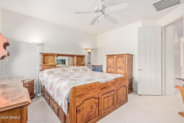 bedroom featuring ceiling fan and light colored carpet