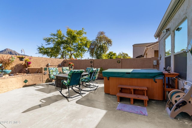 view of patio featuring a hot tub