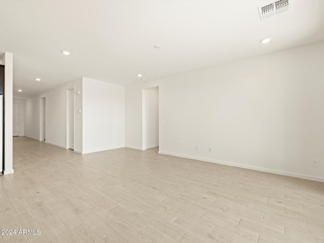 spare room with light wood-type flooring