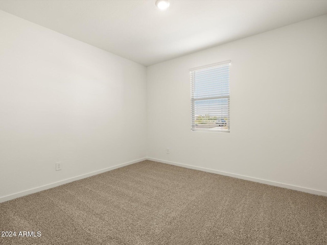 unfurnished room featuring carpet floors