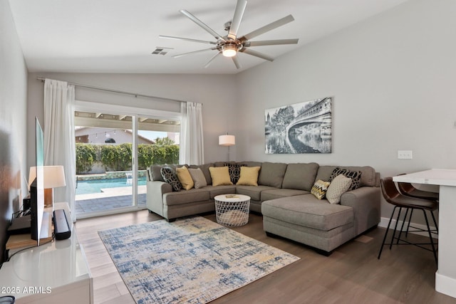 1057 W Laurel Ave, Gilbert, AZ 85233 - living room with vaulted ceiling, ceiling fan, and wood finished floors