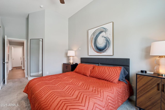 1057 W Laurel Ave, Gilbert, AZ 85233 - bedroom with light colored carpet, vaulted ceiling, and ceiling fan