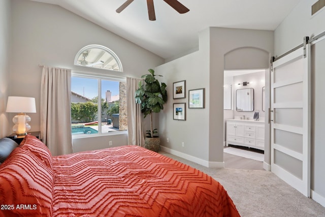 1057 W Laurel Ave, Gilbert, AZ 85233 - carpeted bedroom with a barn door, connected bathroom, high vaulted ceiling, and a ceiling fan