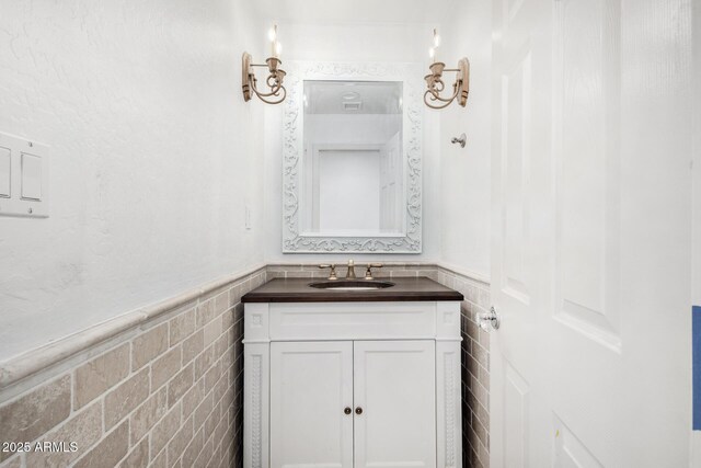 hallway featuring an inviting chandelier and light hardwood / wood-style flooring