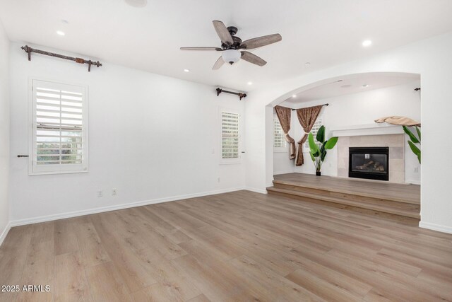 empty room featuring light hardwood / wood-style floors and ceiling fan