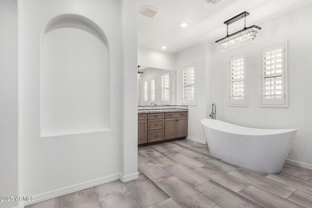 bathroom featuring vanity and an enclosed shower