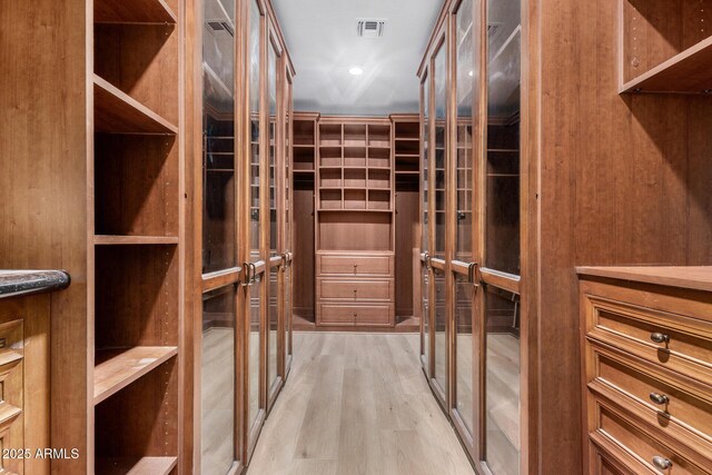 spare room with ceiling fan and light hardwood / wood-style flooring