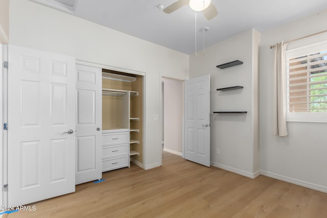 unfurnished bedroom featuring ceiling fan, light hardwood / wood-style flooring, and a closet