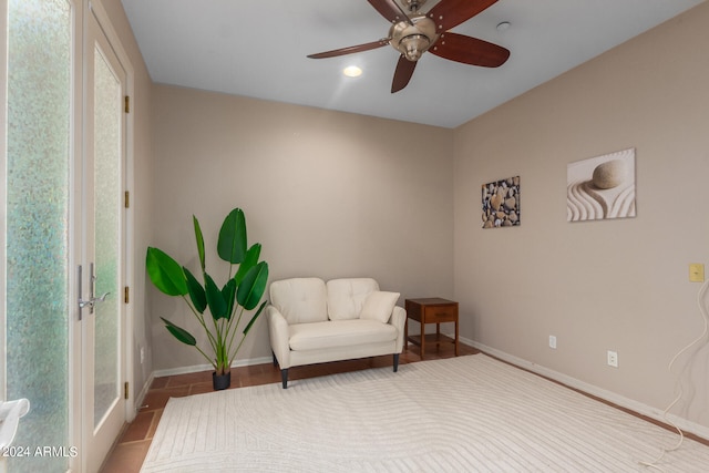 sitting room featuring ceiling fan