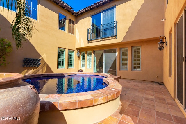 view of swimming pool with a patio