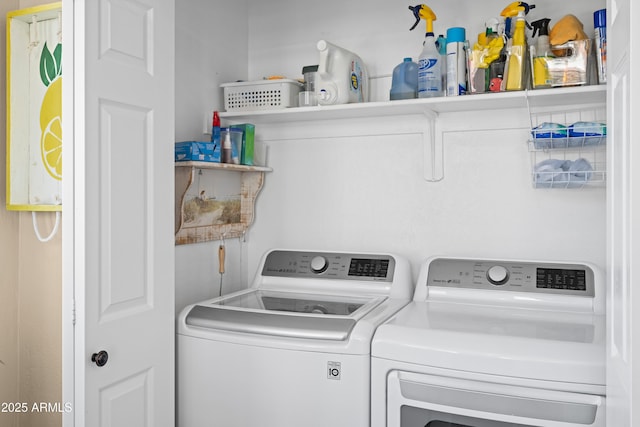 laundry room featuring washing machine and clothes dryer and laundry area
