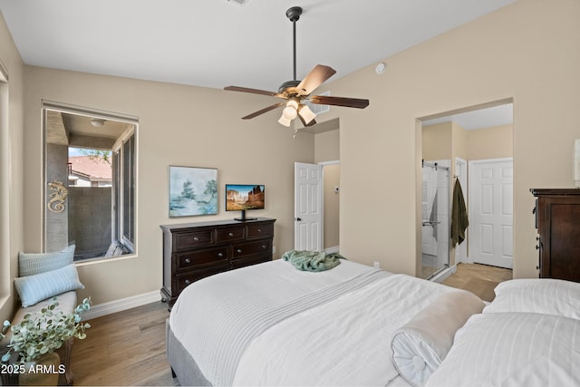 bedroom with baseboards, light wood-style floors, and ceiling fan