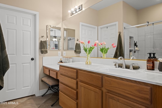 full bath with vanity, tile patterned flooring, and an enclosed shower