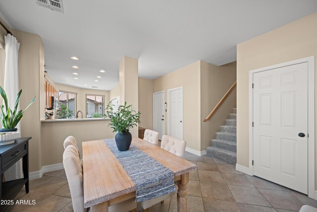 tiled dining room with recessed lighting, baseboards, stairway, and visible vents