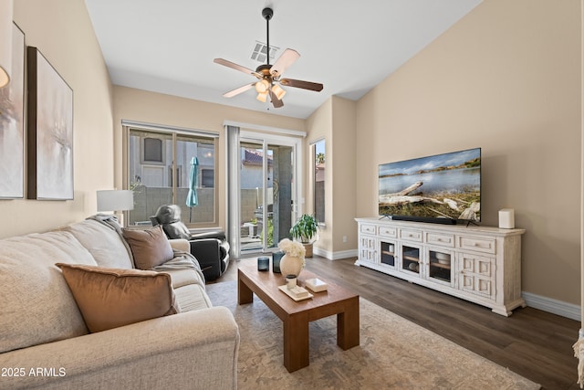 living area with baseboards, wood finished floors, visible vents, and ceiling fan