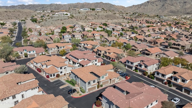 drone / aerial view featuring a residential view and a mountain view