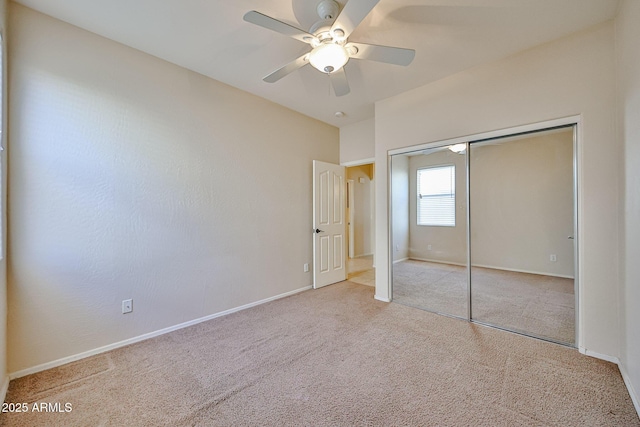 unfurnished bedroom featuring a closet, carpet, and baseboards