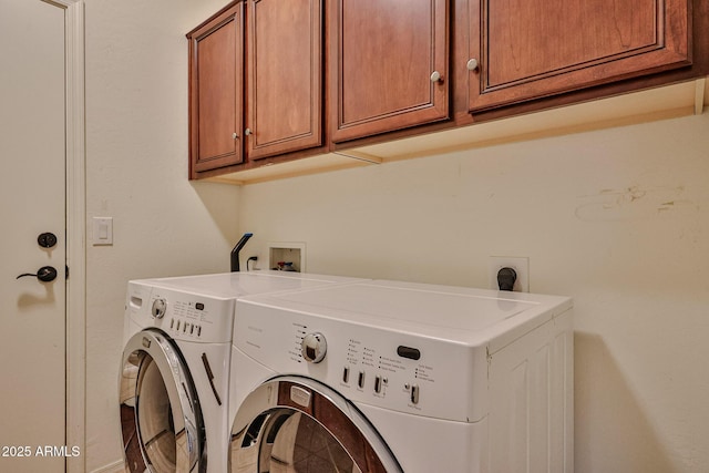 clothes washing area with cabinet space and independent washer and dryer