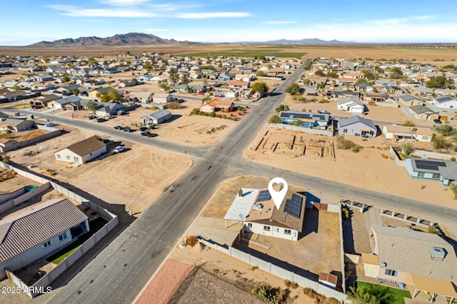 birds eye view of property with a mountain view