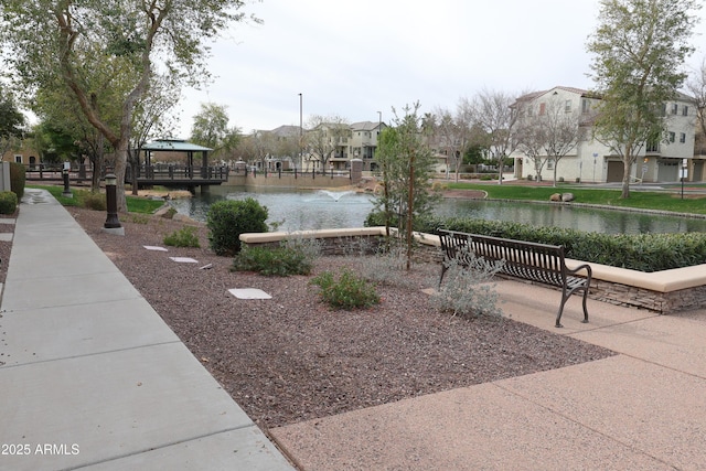 view of community featuring a gazebo, a water view, and a residential view