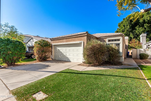 view of front of house with a garage and a front yard