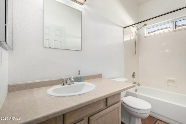 full bathroom with tile patterned floors, shower / tub combination, vanity, and toilet