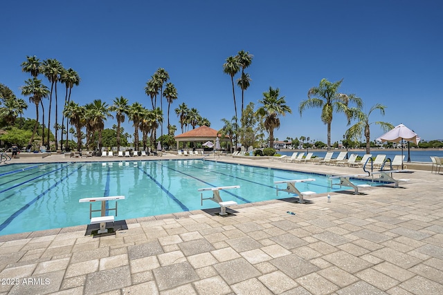 view of pool with a water view and a gazebo