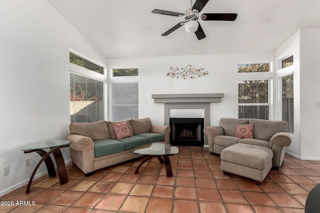 sunroom featuring ceiling fan and vaulted ceiling