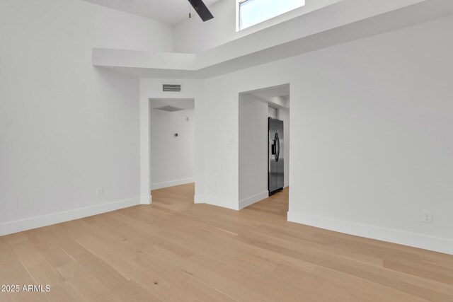 220 N 22nd Pl Unit 2036, Mesa, AZ 85213 - unfurnished room with a high ceiling and light wood finished floors