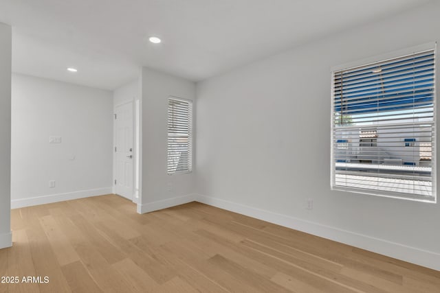 220 N 22nd Pl Unit 2036, Mesa, AZ 85213 - spare room featuring healthy amount of natural light, light wood-style floors, and recessed lighting