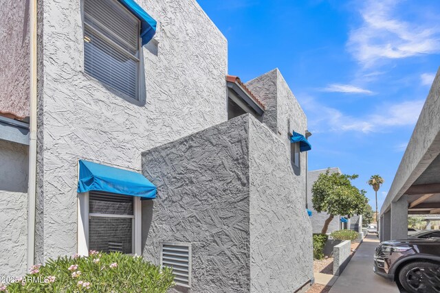 220 N 22nd Pl Unit 2036, Mesa, AZ 85213 - view of side of home featuring stucco siding