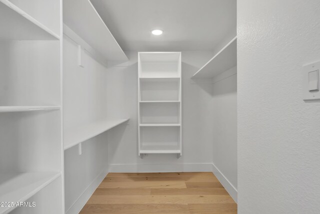 220 N 22nd Pl Unit 2036, Mesa, AZ 85213 - walk in closet featuring wood finished floors