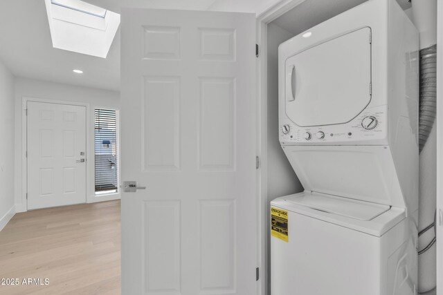 220 N 22nd Pl Unit 2036, Mesa, AZ 85213 - laundry area with stacked washing machine and dryer, a skylight, light wood-style flooring, and recessed lighting